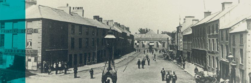 Image: an old photograph of Carrickfergus from the 1800s