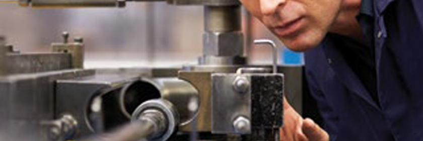 Photograph of someone using machinery