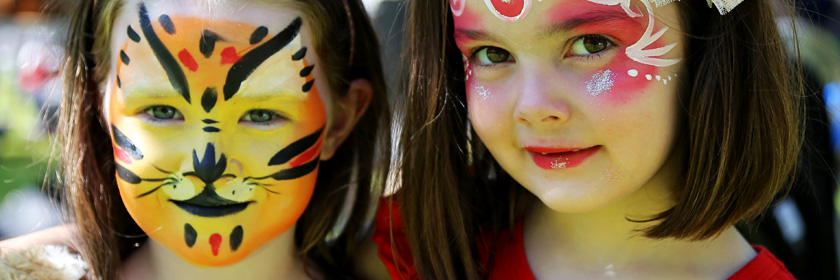 Photograph of two children with facepaints