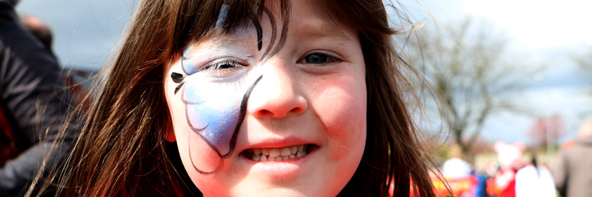 Photograph of child with her face painted