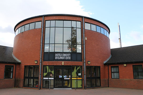 An external view of the entrance to Oakfield Community Development Centre showing the ground level, accessible entrance.