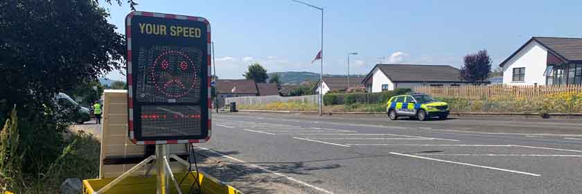 Speed Identification Device with Police car in background