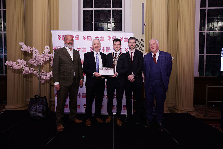 Bertie McNeilly from Cullybackey Community Partnership, Richard Hanna from Cullybackey Community Partnership, Paul Christie from Cullybackey Community Partnership and Jonathan Fulton from Cullybackey Community Partnership are presented the Regional Champion Runner-Up from Deputy Mayor of Mid and East Antrim, Councillor Tyler Hoey (centre)
