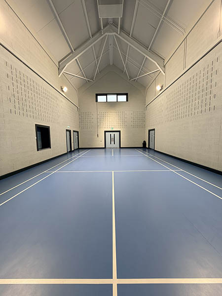 View of the main hall of Waveney Community Centre showing the high roof and sports lines on the floor