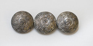 brooch is made from 3 An Garda Siochana buttons