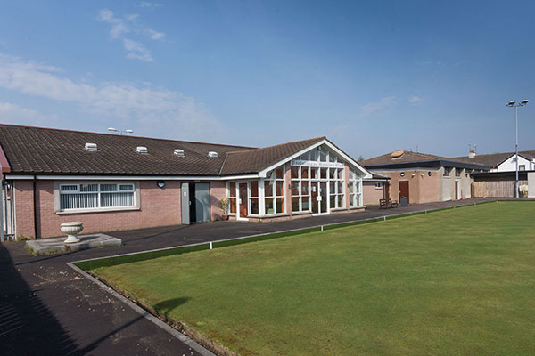 A view of the ground level entrance at Portglenone Community Centre, looking out over the bowling lawn.