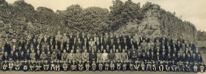 Boys school photo taken behind school building at Joymount