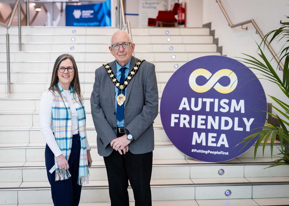 Mayor of Mid and East Antrim, Councillor Jackson Minford pictured with DEA Officer Karen Brownlow for the launch of World Autism Acceptance Month.