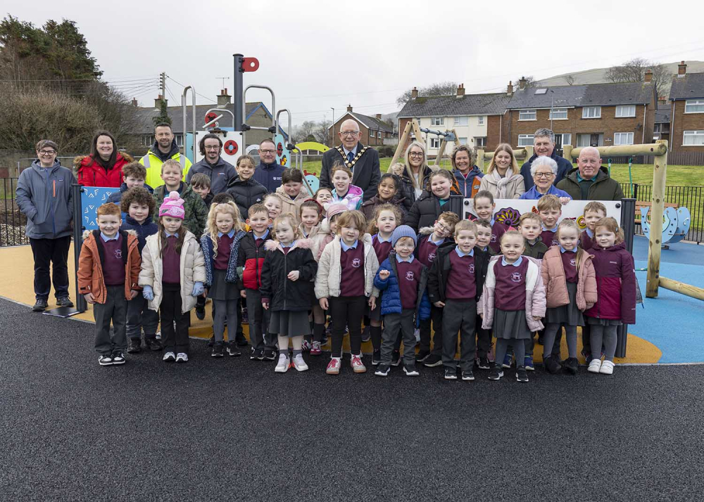 Mayor of Mid and East Antrim, Councillor Jackson Minford, pictured with children from St John’s and Carnlough Integrated Primary Schools, along with community representatives, contractors, councillors and council staff.