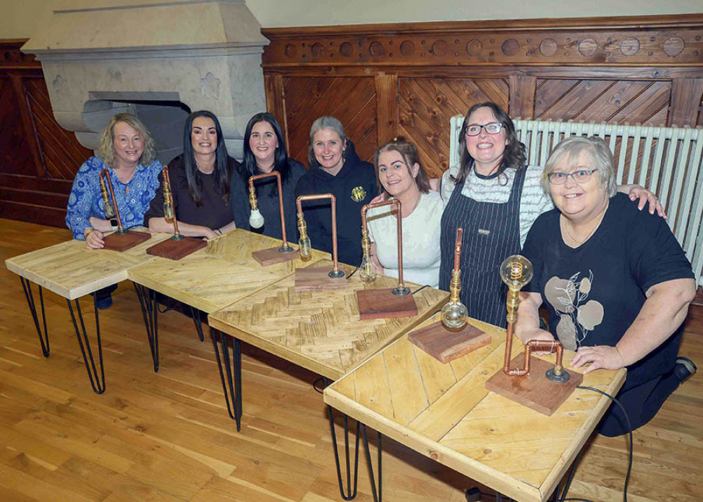 Picture of participants with their bespoke lamps created at the MEA DIY Bootcamps.