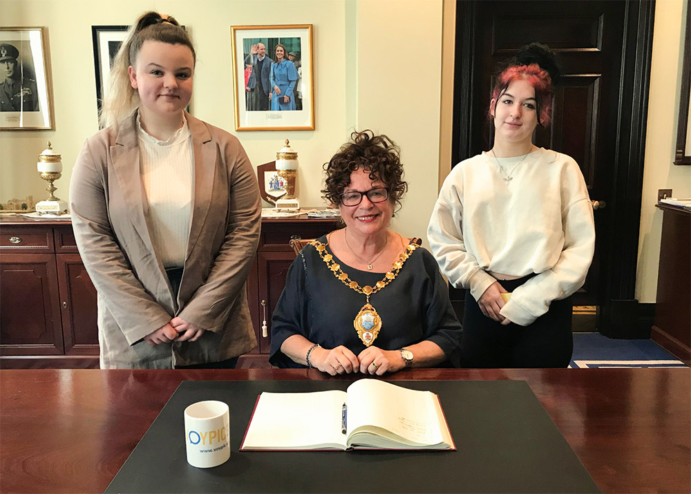 Mayor of Mid and East Antrim, Ald Geradine Mulvenna, with Madison (17) and Makyla (18) from VOYPIC, at the Care Day Breakfast