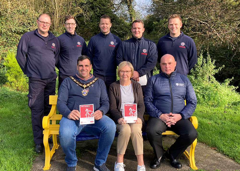 Deputy Mayor of Mid and East Antrim, Alderman Stewart McDonald with Mid and East Antrim Loneliness Network Chairperson Marjorie Hawkins , Cllr Barr and members of the local team from NIFRS.