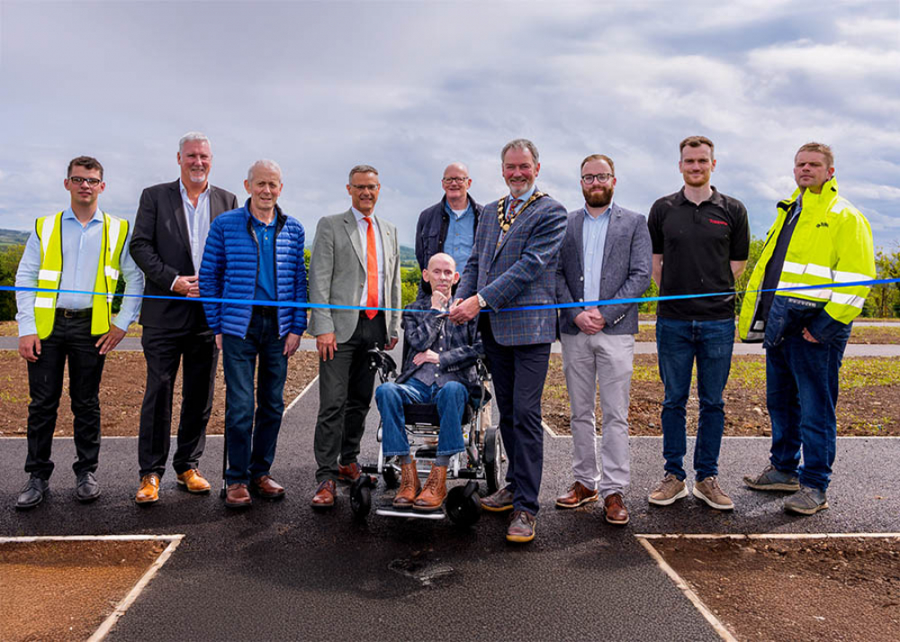 Outgoing Mayor of Mid and East Antrim, Alderman William McCaughey is joined by landowners, Brian Calwell and Ian Hazlett for the official opening of the Clough Cemetery extension.