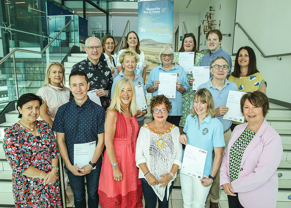 Mayor of Mid and East Antrim, Alderman Gerardine Mulvenna with Council representatives and tour guides.