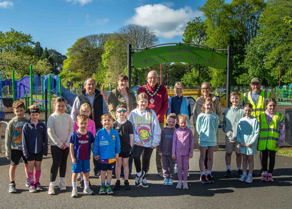 Mayor of Mid and East Antrim, Councillor Jackson Minford pictured with junior parkrun runners and volunteers at The People's Park.