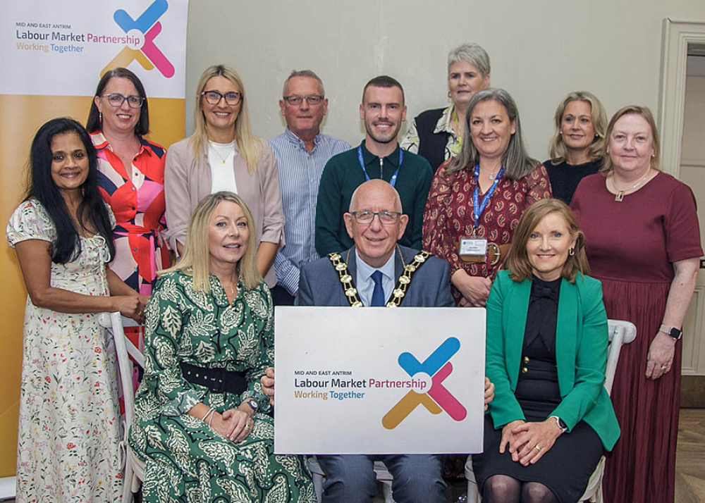 Mayor of Mid and East Antrim, Councillor Jackson Minford, is pictured with Mid and East Antrim Labour Market Partnership members and representative from the Department for Communities who funds the initiative.