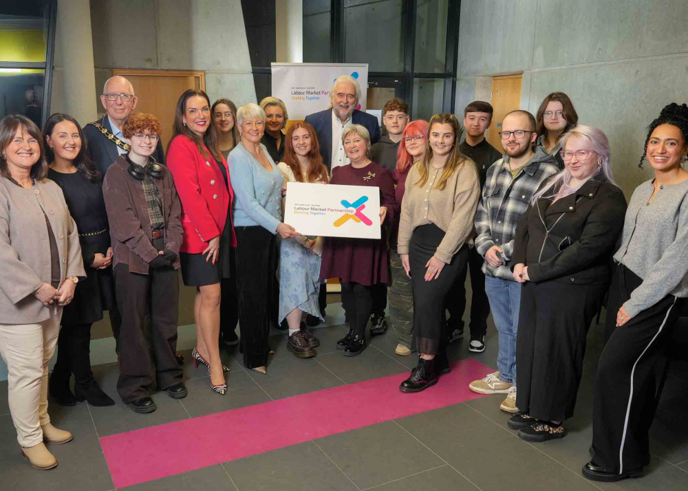 Photo of Mayor of Mid and East Antrim, Councillor Jackson Minford pictured with Joan Burney Keatings MBE with cast and crew from Cinemagic Placement Insights Programme.