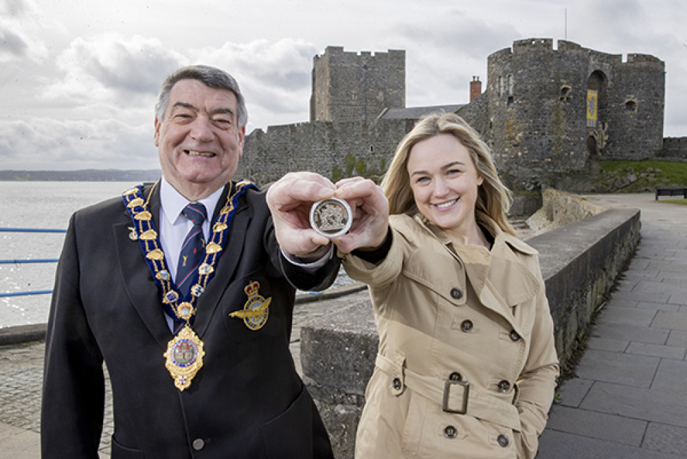 Mayor of Mid and East Antrim, Alderman Noel Williams, with Chair of Council’s Coronation Working Group, Cllr Cheryl Brownlee holding a coin similar to those which will be distributed.