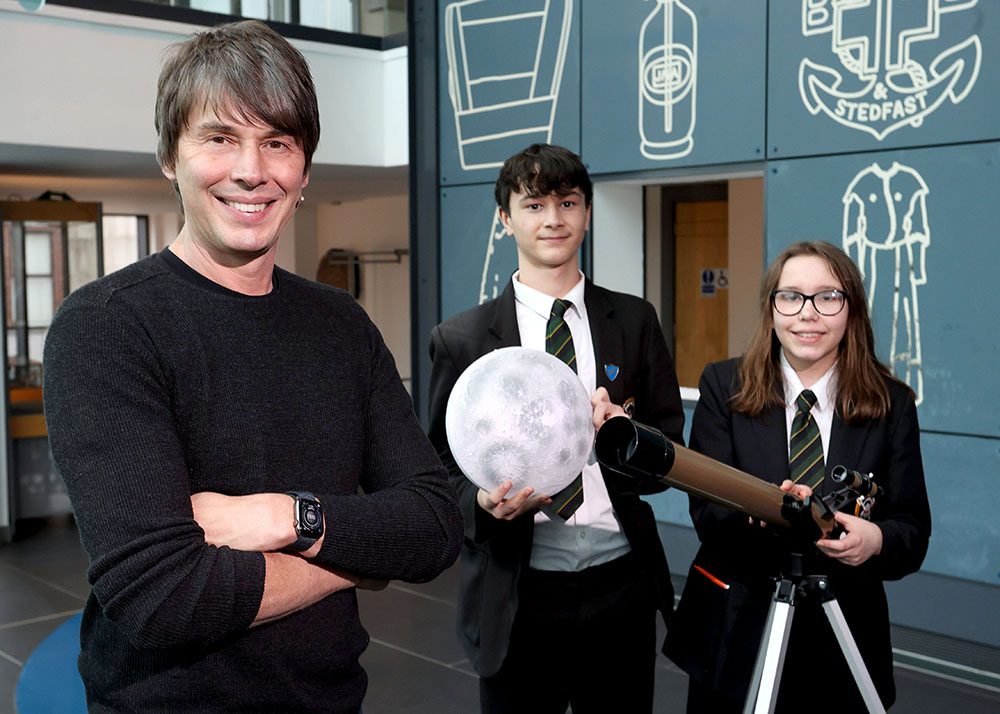 Professor Brian Cox and pupils at the Science Summer School event in The Braid, Ballymena