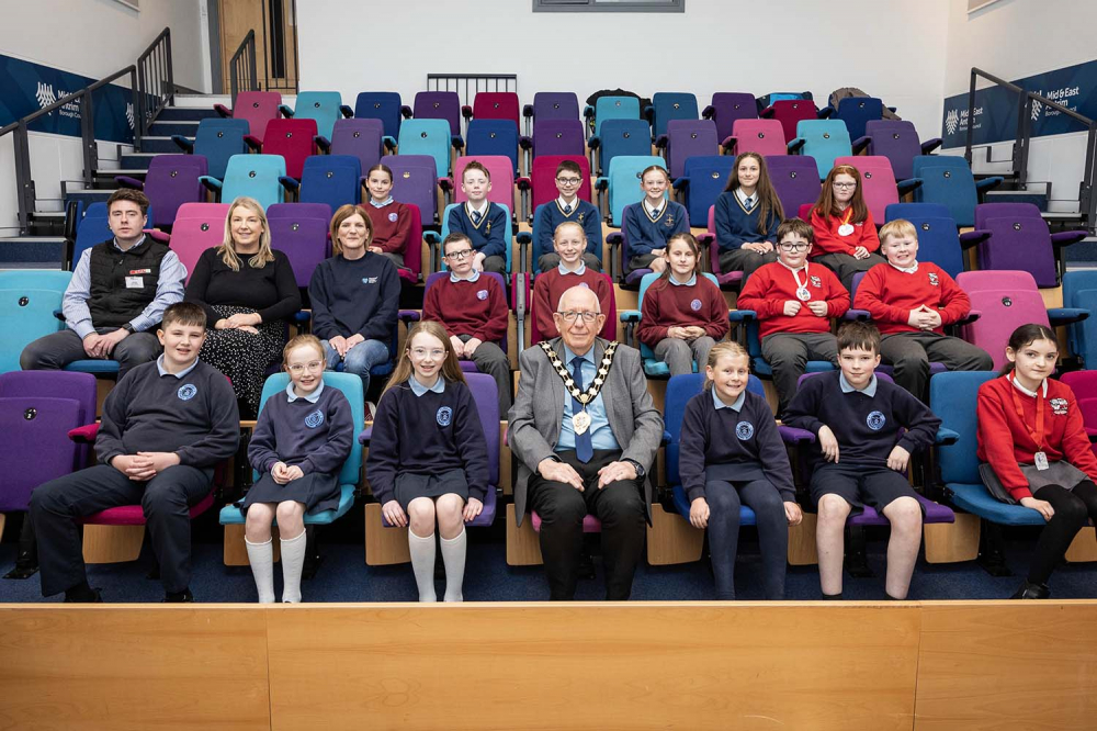Mayor Jackson Minford with pupils who have taken part in Business Beginnings, part of Mid and East Antrim Borough Council's Go Succeed programme