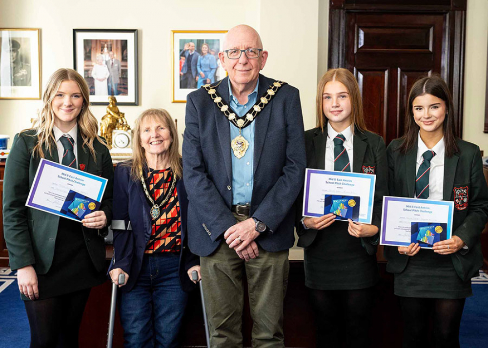 Pictured is the Mayor and Mayoress of Mid and East Antrim, Councillor Jackson Minford and Allison Minford with Grace, Maisy and Emma from Cambridge House Grammar School with their winning idea 'Strike City' at the MEA Student Pitch challenge.