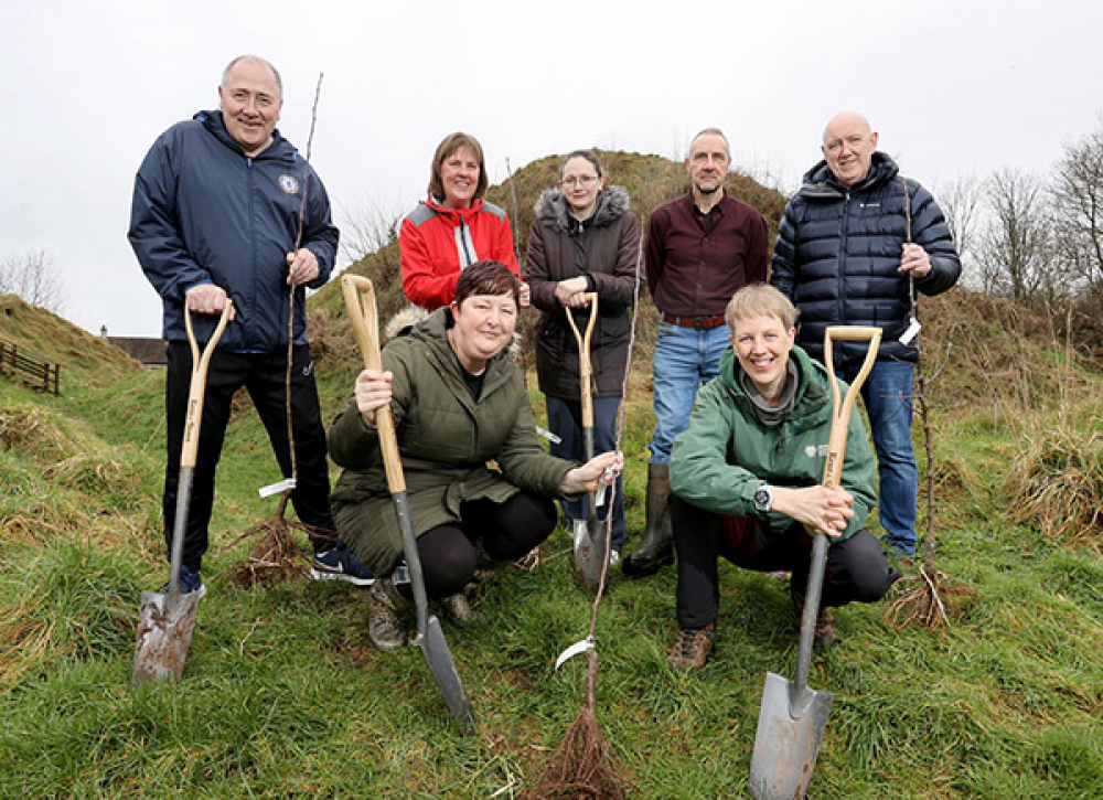 Pictured: Kneeling at front - Susan Lynn, Tree and Woodland Officer and Ronda Rainey (Carson Women's Group) Back row - Cllr Rodney Quigley (Carson Project), Christina McNeilly (Carson Women's Group), Kim Berry (Carson Women's Group), Cyril Rainey (Carson