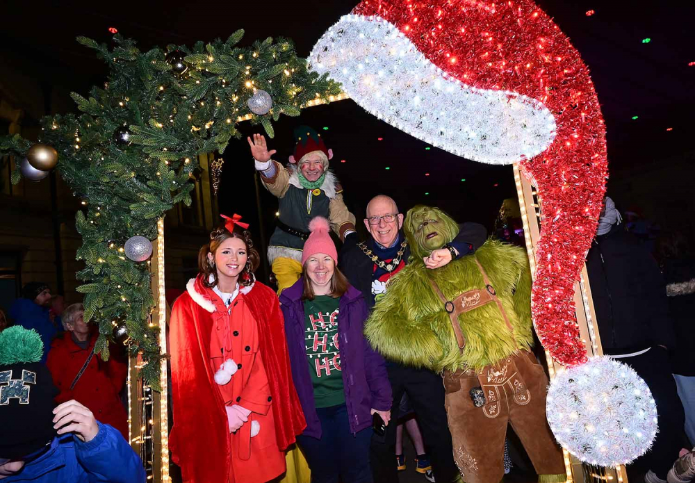 The Mayor making sure the Grinch doesn't get up to mischief at the Ballymena Christmas lights switch-on