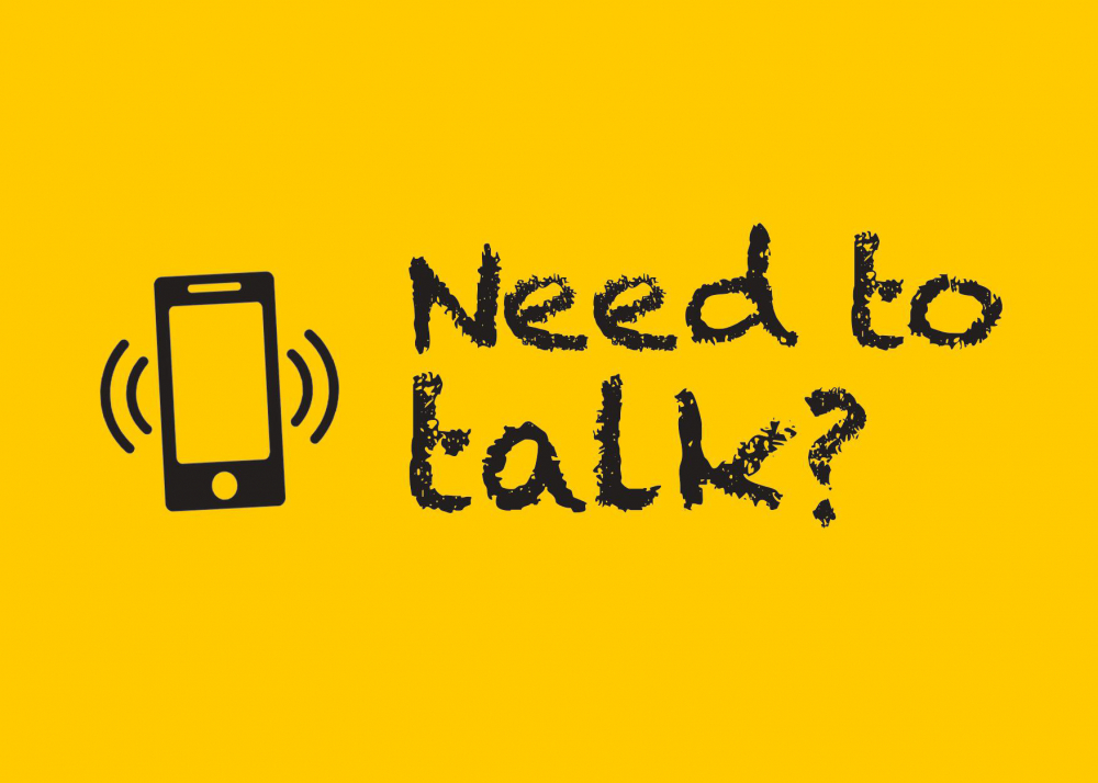 Black text: Need to talk? on a yellow background.