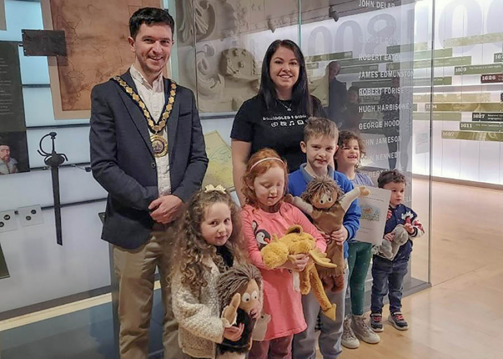 Mid and East Antrim Deputy Mayor, Councillor Tyler Hoey, pictured with author and illustrator Kelsey Carroll and children who took part in the workshop