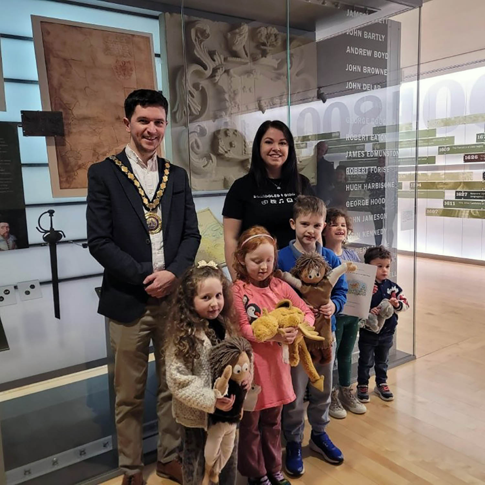 Mid and East Antrim Deputy Mayor, Councillor Tyler Hoey, pictured with author and illustrator Kelsey Carroll and children who took part in the workshop