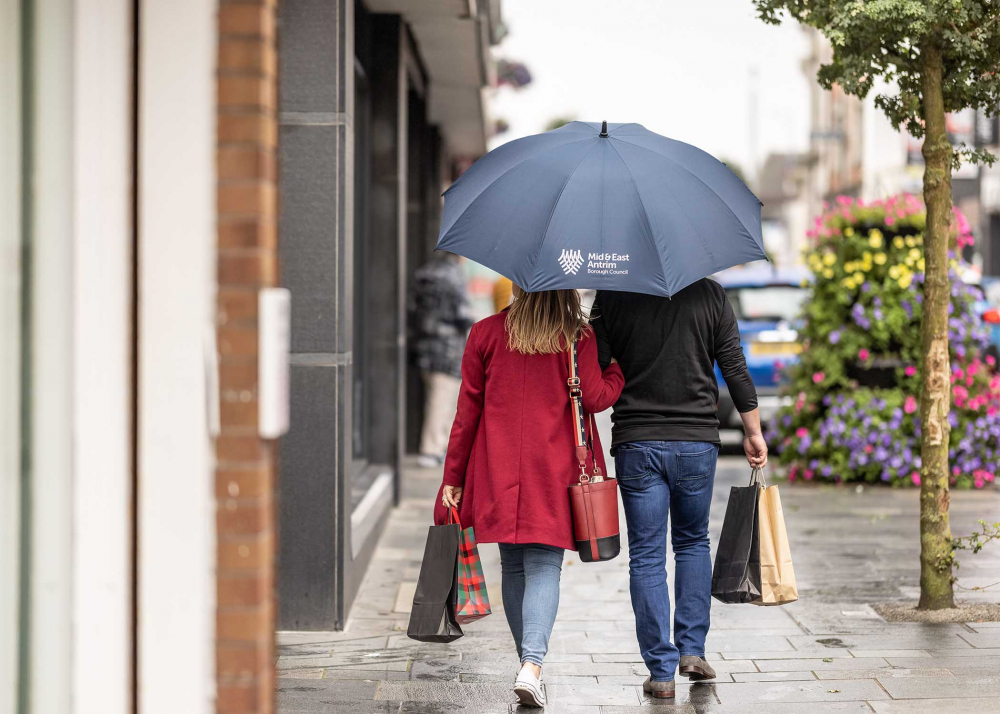 Male and Female walking arm in arm enjoying shopping in the Borough