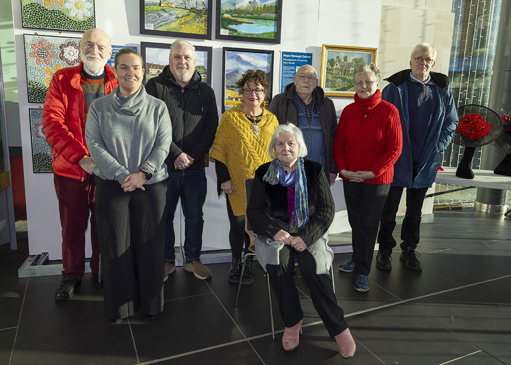 Mick Turner, Alison Adams (Alzheimer’s Society), Conor Lawell (Dementia NI), Mayor of Mid and East Antrim, Ald Gerardine Mulvenna, Maureen Patterson (seated), Tommy Foster, Mrs McIlroy (representing artist William McIlroy) and Albert McNinch.